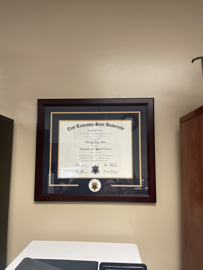 East Tennessee State University diploma frame on office wall