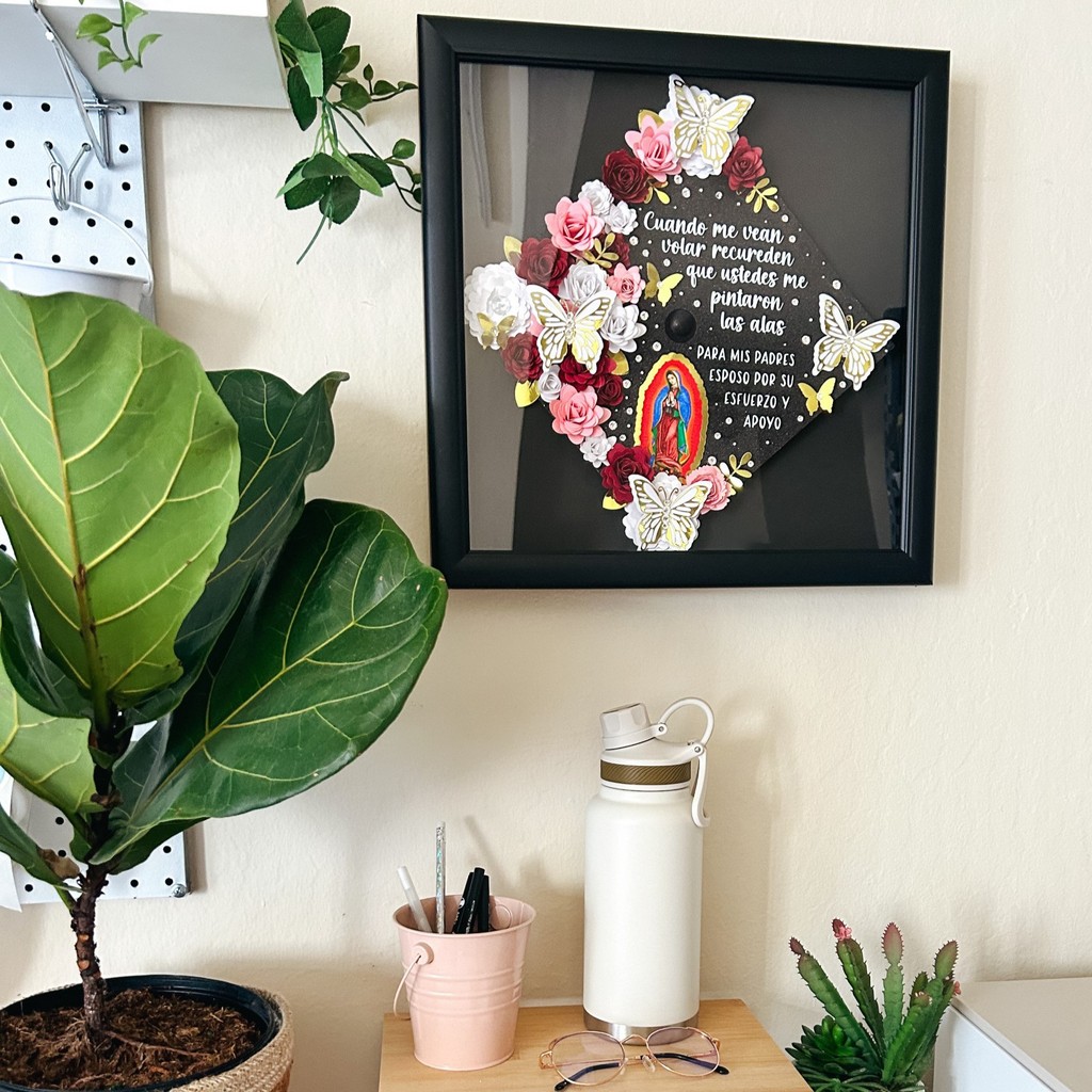 floral butterfly grad cap hanging on wall in grad cap shadow box