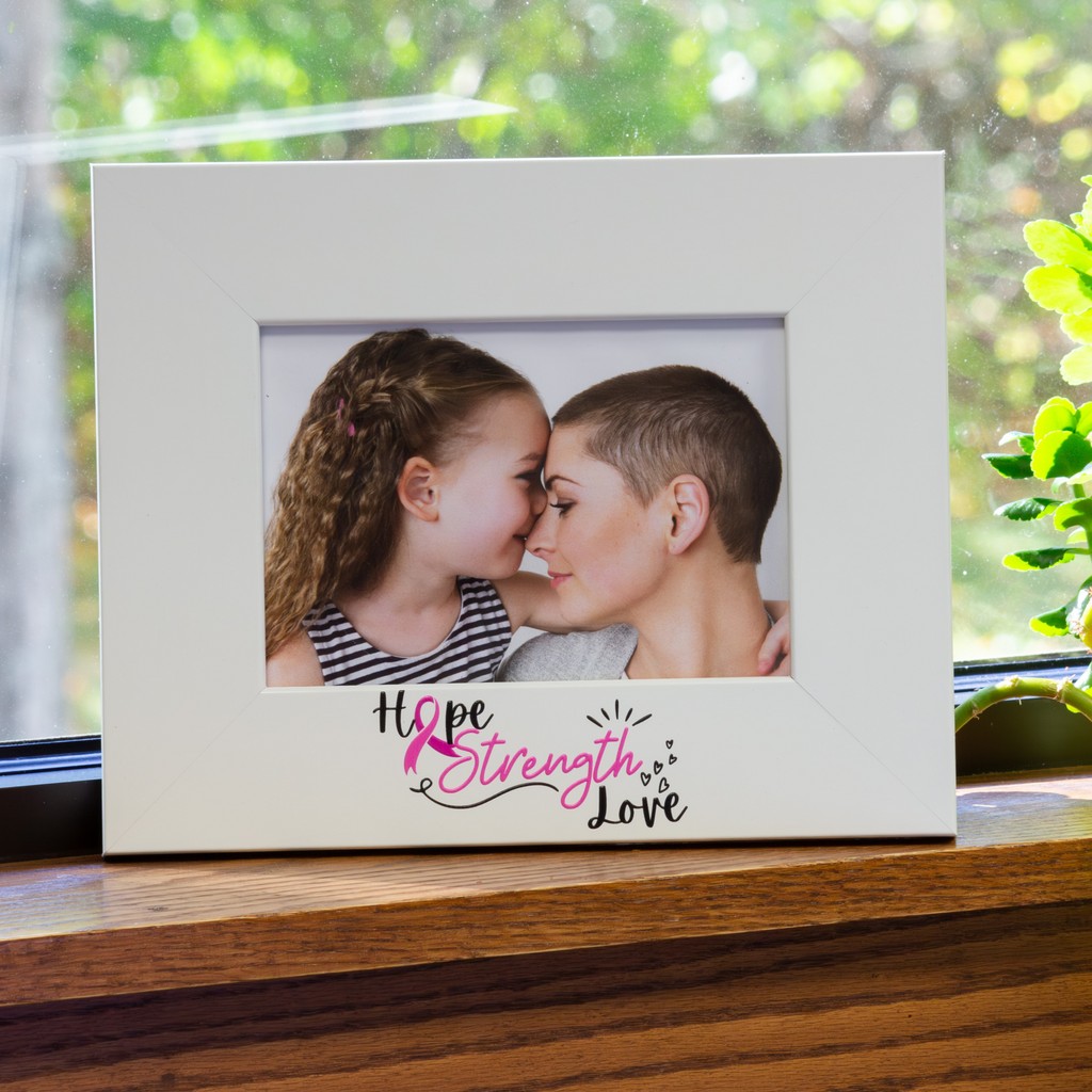 Breast Cancer Awareness photo frame holding photo of daughter kissing mom on forehead