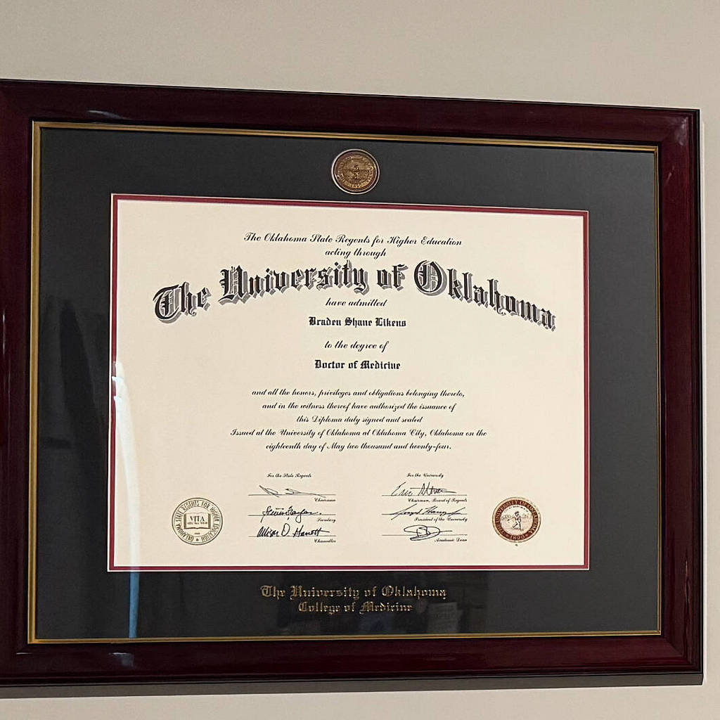 closeup of University of Oklahoma medical degree frame on wall