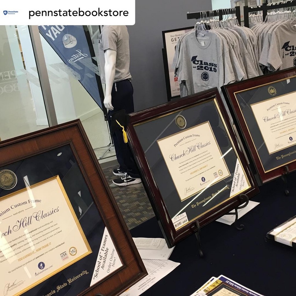 three Pennsylvania State University diploma frames displayed on a table