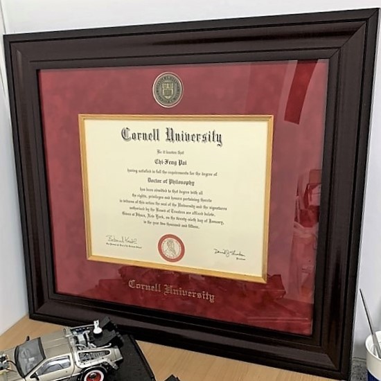 Cornell University Presidential diploma frame on a table