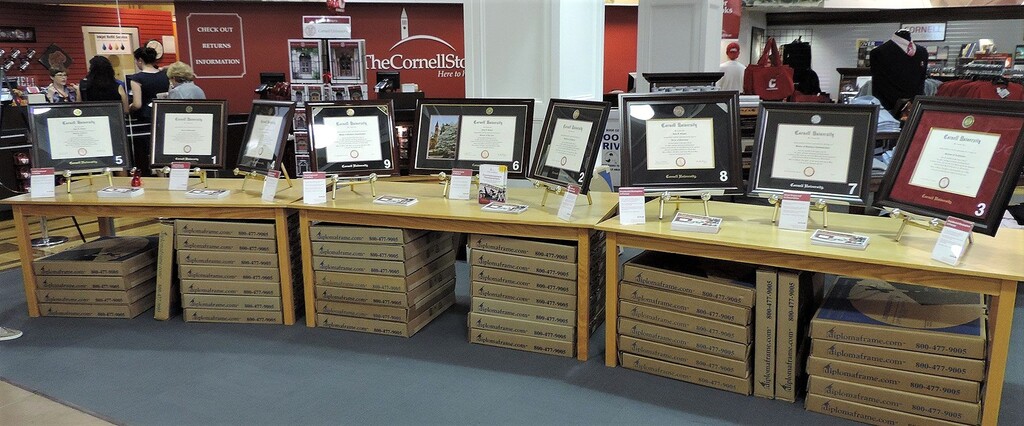 Cornell diploma frames displayed on tables at The Cornell Store