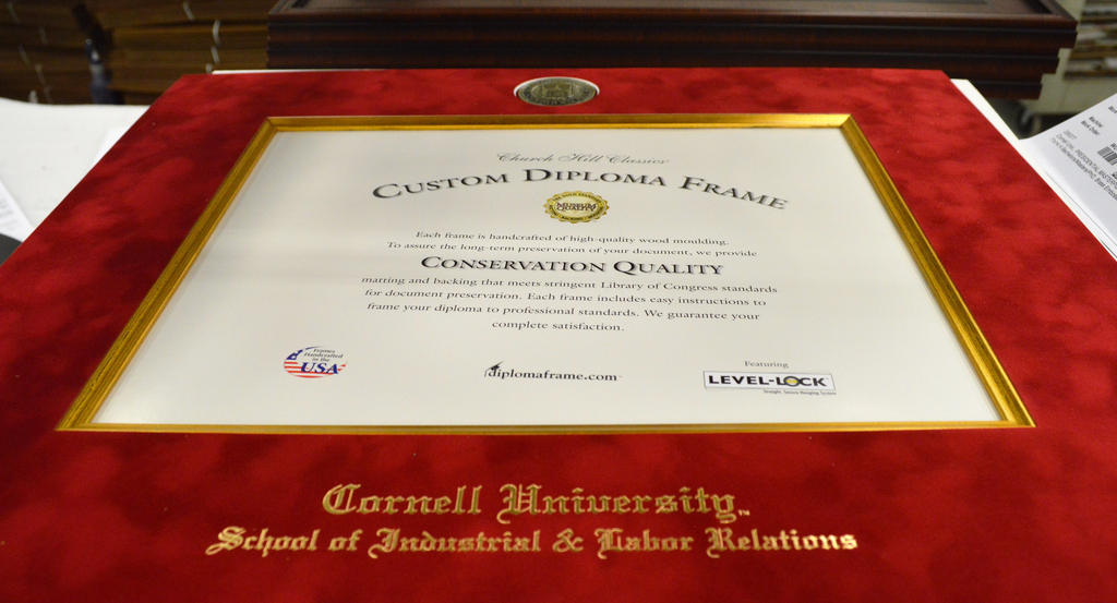 Preparing to assemble a Cornell U diploma frame