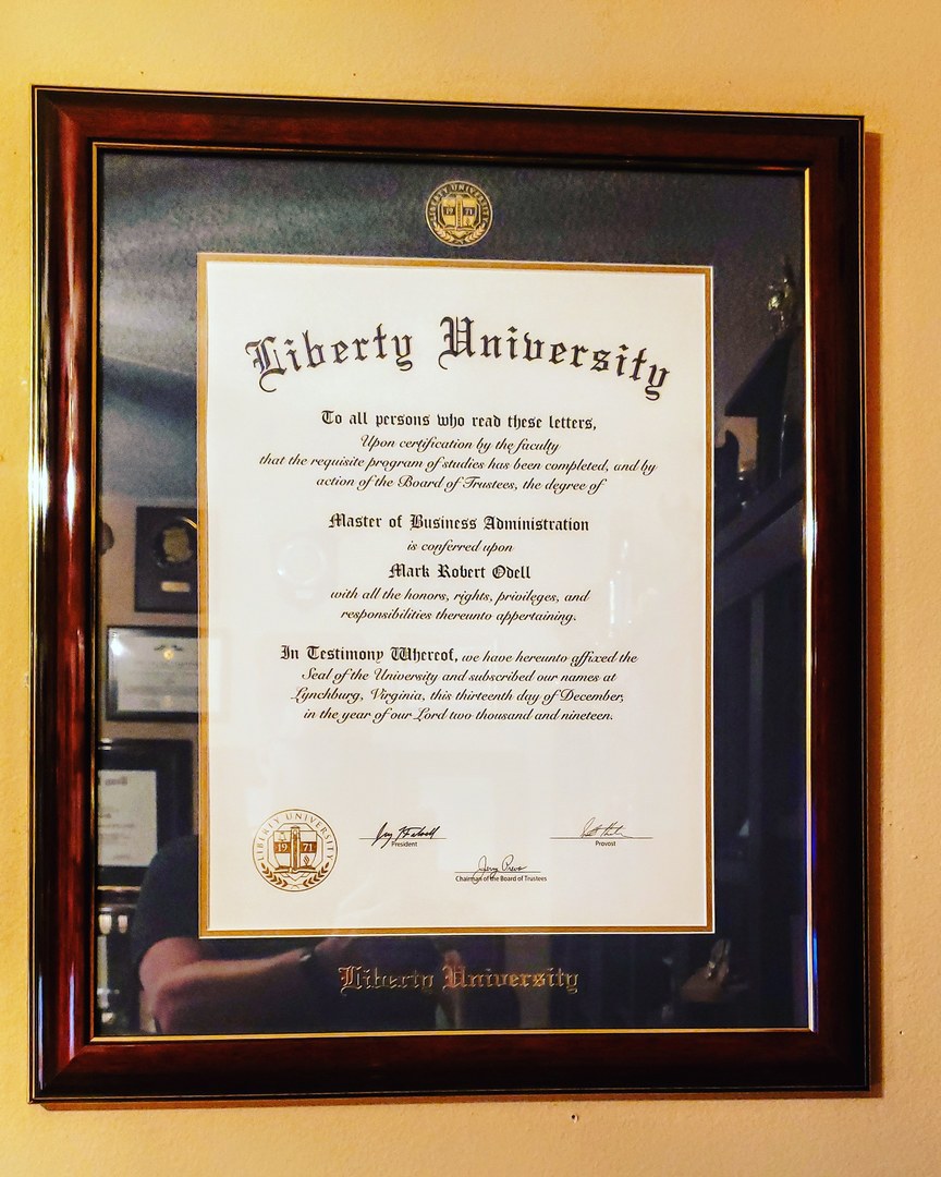 Liberty University diploma frame hanging on a wall