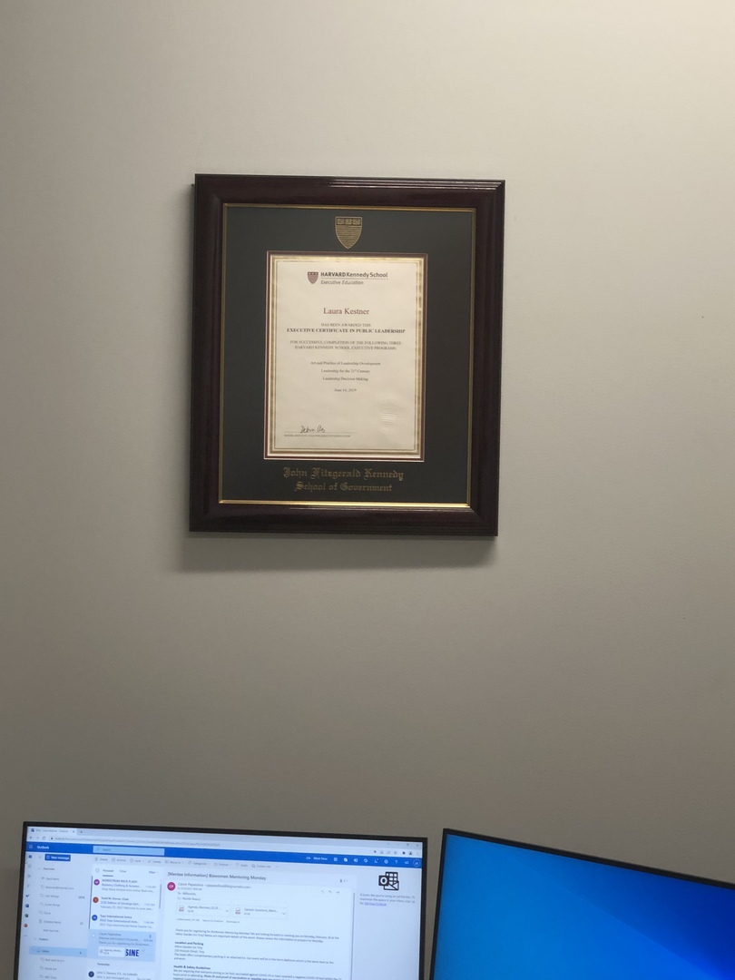 Harvard University School of Government degree frame hanging on a wall