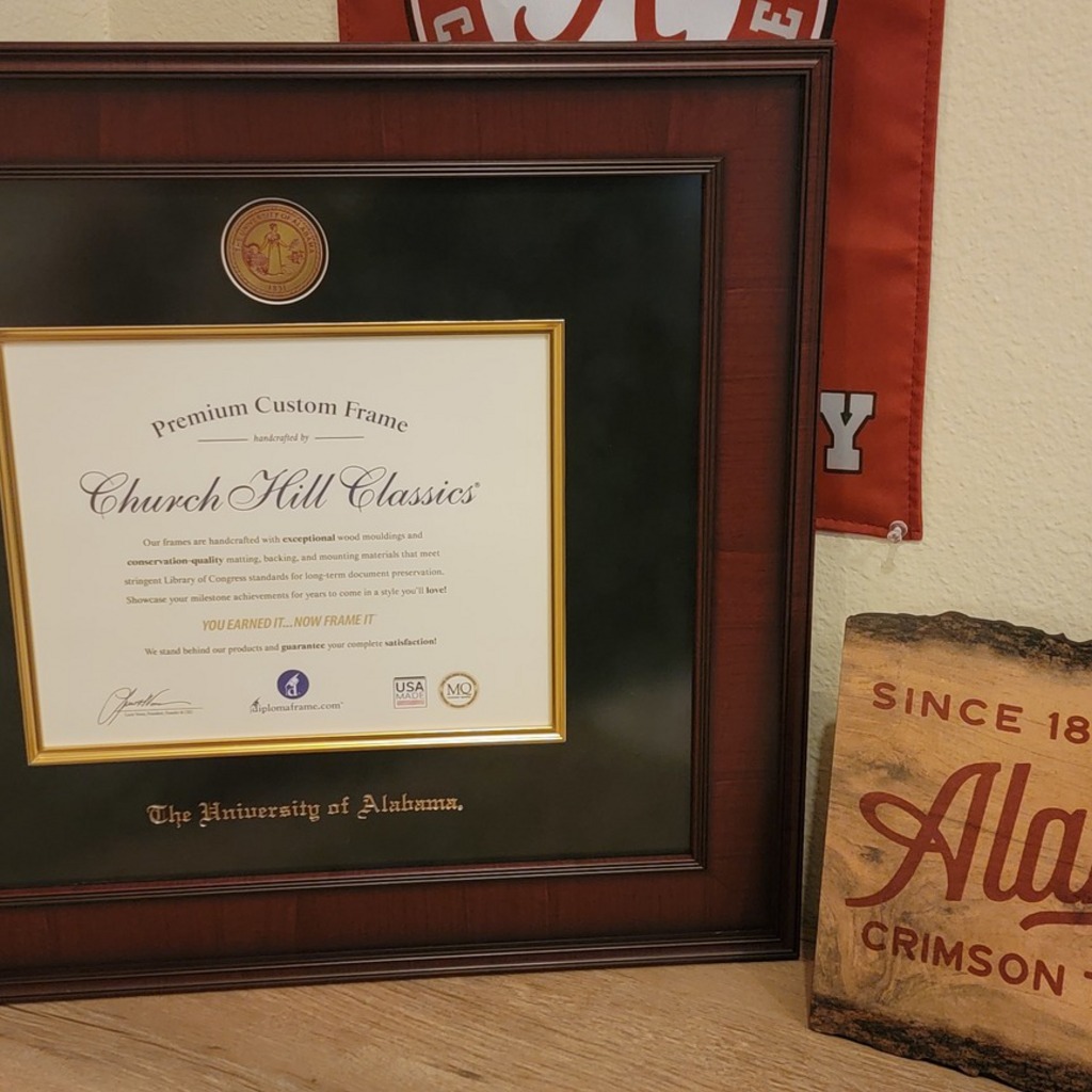 The University of Alabama Tuscaloosa diploma frame with Alabama memorabilia